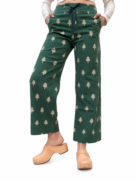 Mildly Outdoorsy green women's cotton canvas pants with pine tree print, front view